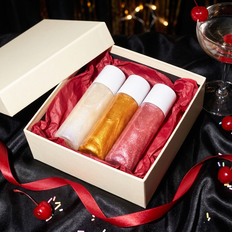 Ivory Pearl, Molten Gold and Rose Glow in a gift box on black satin with cherries
