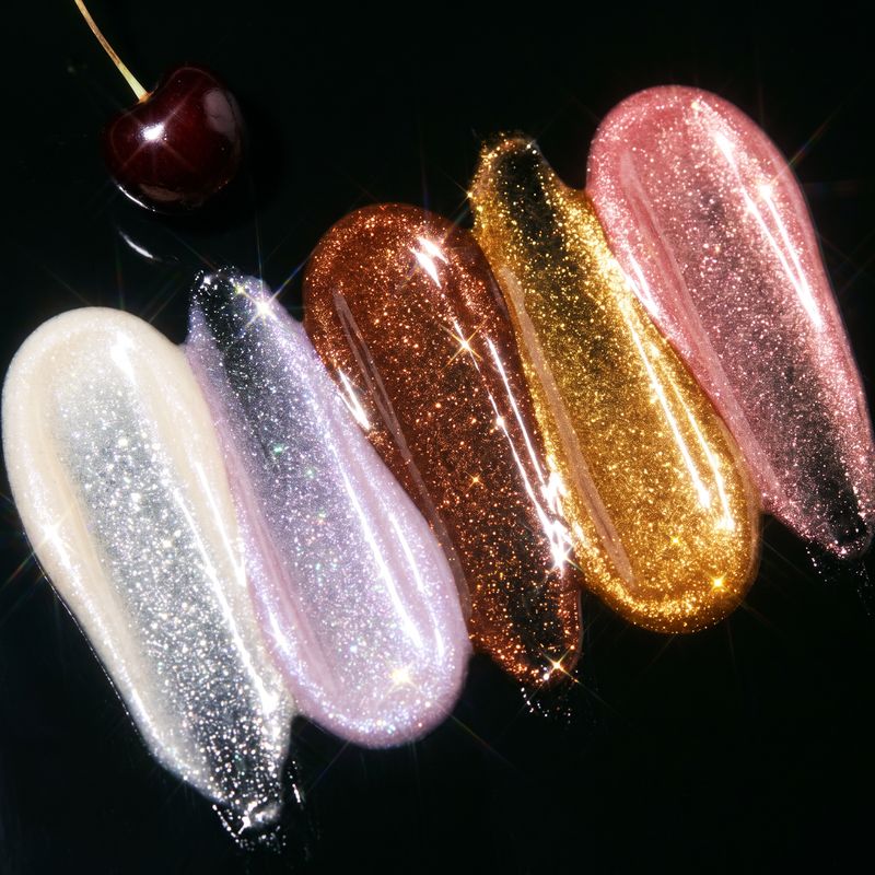 Five shimmer swatches sparkling on black